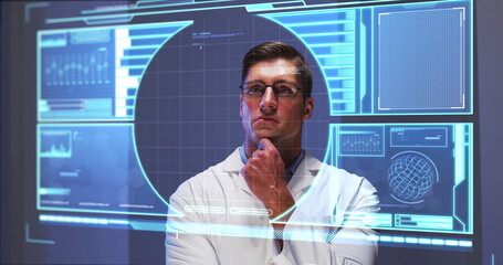 Image of male scientist behind digital screen with covid 19 cell and medical data