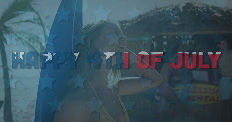 Independence day text against caucasian woman with surf board at the beach