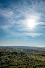 Obraz premium Eierland, De Cocksdorp, Texel, The Netherlands, Oktober 28th, 2024, A truly stunning and breathtaking view of a lush green landscape illuminated by the bright sun in a clear, blue sky