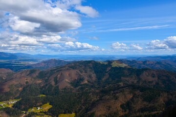 Panoramic view of forest covered hills with Jošt hill in Gorenjska, Slovenia