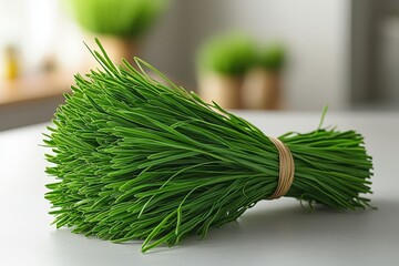 Fresh organic chives bunched with rubber band on kitchen counter