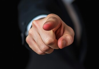 Focused Gesture of a Person Pointing Finger Towards the Viewer