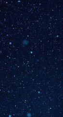 Obraz premium Serene night sky with falling snowflakes captures winter's quiet magic