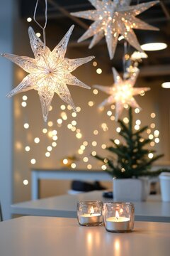 The breakroom decorated with delicate Ramadan lights and hanging star ornaments. Small candles add warmth to the tables