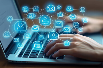 Close-up of hands typing on a laptop with blue icons representing people and an envelope