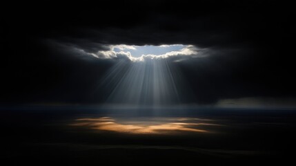 Light piercing dark clouds.  Vast expanse below