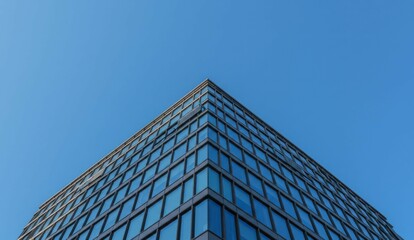 Modern building against clear sky, low angle shot, architectural detail,