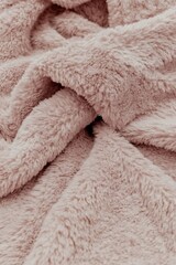 Delicate rose plush textile texture, inviting warmth and soft comfort