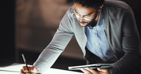 Drawing, night and man in office, tablet and deadline for project, inspiration and skills. Person, evening and employee in workspace, architecture and engineering with planning, app and creativity