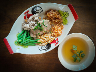 Thai Cha Kang Rao, a white noodle with minced pork, pork skin sliced yardlong bean with shredded...