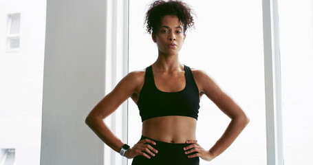 Portrait, fitness and serious with woman in gym for exercise, training or workout routine....