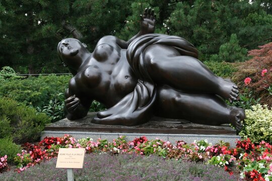 Reclining bronze sculpture "Jeune fille &agrave; la balle" by Fernando Botero in Lausanne, Switzerland