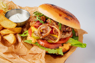 Indulge in a mouthwatering burger stacked with fresh toppings and served with crispy fries