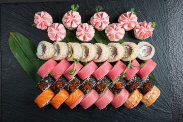 A stunning sushi platter features vibrant rolls and delicate garnishes, inviting you to taste
