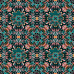 Complex seamless ethnic ornament with mandalas and flowers in fashionable colors transformative teal and mocha mousse. Beautiful textile print.
