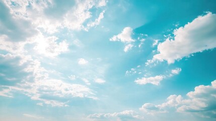 Fototapeta premium Soft blue sky merging with fluffy pastel clouds, light brushstroke effect for a hand-painted aesthetic, calm and serene