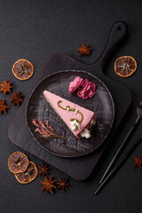 A piece of pink layered cake with strawberry flavor