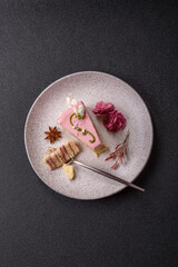A piece of pink layered cake with strawberry flavor