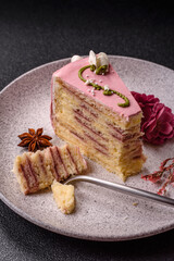 A piece of pink layered cake with strawberry flavor