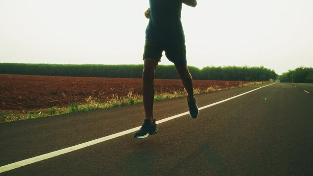runners is running on the road at outdoors.healthy lifestyle and sport concepts.Sprinting Endurance Workout Training.running for Striding Towards the Future.The Determined Runner.