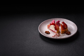 Round sweet tart with strawberry pieces and cream