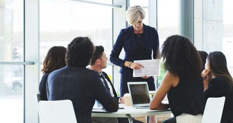 Business people, presentation and woman in office, tablet and corporate training for investment charts. Employees, coworking or coaching in workplace, fintech and meeting for profit growth or talking