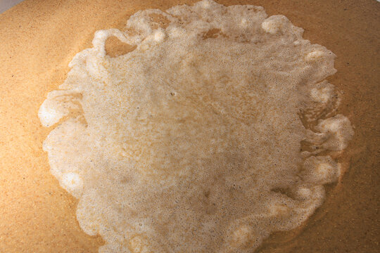 Fermentation process of beer in large brewery tank with yeast and malt