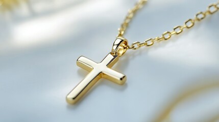 Golden cross pendant on a delicate chain, symbolic and elegant