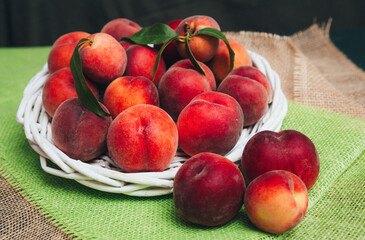 Velvet juicy peaches on table with copy space