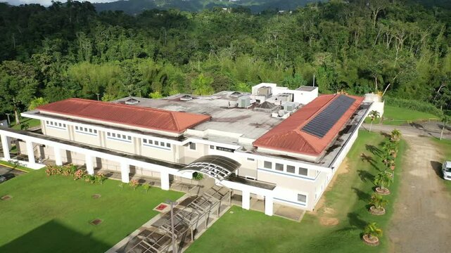 buildings with solar panels on its tiled roof belong to UPR - University of Puerto Rico in Utuado