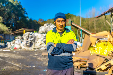 Portrait of a latin worker outdoors a recycling plant