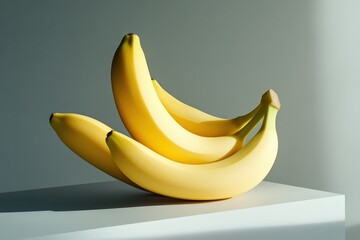 A bunch of ripe yellow bananas presented on a white surface