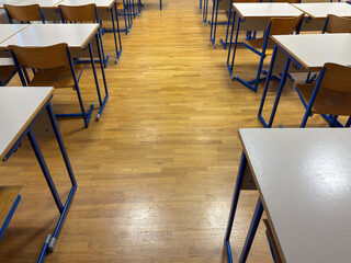 Symmetrical View of Empty Classroom Aisle Representing Focused Learning Environment
