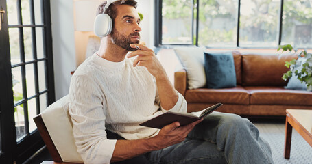 Thinking, man and headphones in home for notebook, writing thoughts and personal reflection with...