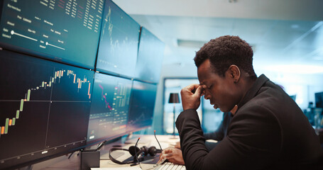 Trading, man and broker with headache by computer for stock market crash, financial crisis and bad...