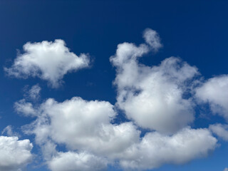 Blue summer sky with white clouds for use as a background