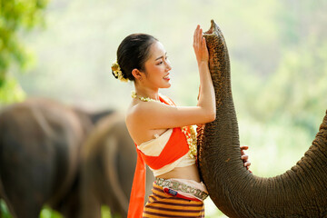 Closeup portrait of beautiful Thai woman in the Thai northern traditional dress photo shoot and...