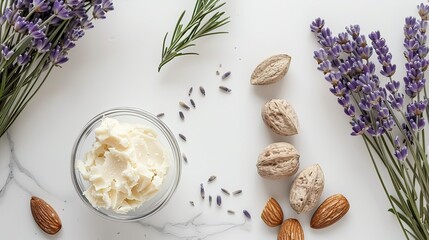 Lavender sprigs, whole almond nuts, and jojoba butter are artfully arranged on a white surface, showcasing natural beauty and calm