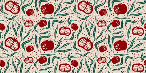 Pomegranate seamless pattern in boho style - organic abstract cut out shapes. Hand drawn fruits and leaves silhouettes in red and green colors. Playful botanical repeat ornament for fabrics design. © klyaksun
