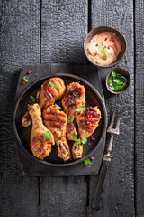 Hot grilled chicken leg as summer delicacy in sunny day.