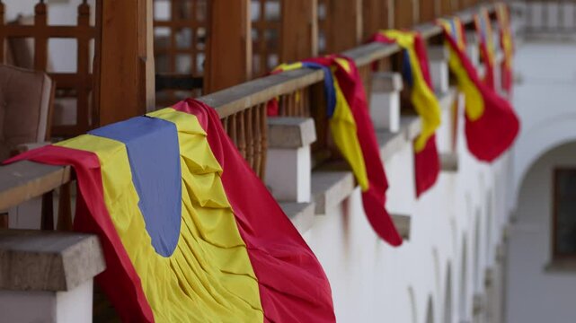 Romanian party flags waiving on the old balcony