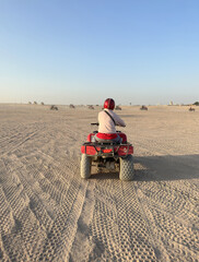 Quad bike adventure through the desert in a sunny afternoon at Hurghada, Egypt © Crystaltmc