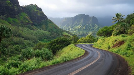 Fototapeta premium Winding mountain road surrounded by lush greenery