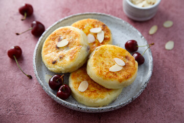 Banana cottage cheese cakes with cherries and almond