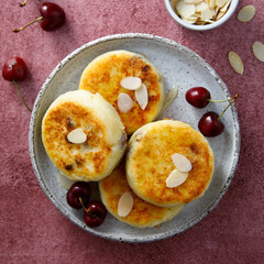 Banana cottage cheese cakes with cherries and almond