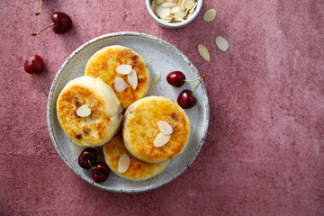 Banana cottage cheese cakes with cherries and almond
