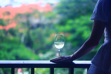 A glass of white wine on a blurred abstract background, alcohol, relaxation
