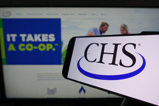 Kiel, SH, Germany March 24 2025: Smartphone displaying CHS logo in front of company website on a monitor, showcasing digital branding and corporate identity effectively