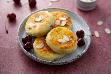 Banana cottage cheese cakes with cherries and almond
