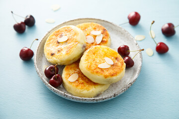 Banana cottage cheese cakes with cherries and almond